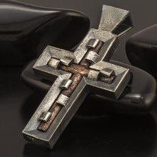 Side view of the industrial cross pendant showcasing the substantial 3mm copper interior and silver frame