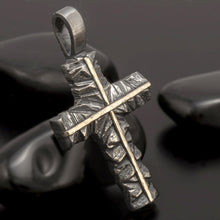 Luxury mens spiritual necklace featuring a unique mixed metal cross design in silver and 14k gold.