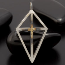 The artisan P-165 necklace shown next to a ruler to display its unique geometric proportions