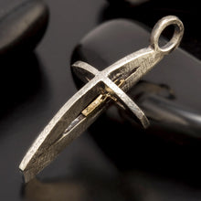 Back view of the handmade P-166 cross pendant, highlighting the artisan finish and quality materials.