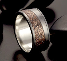 Handmade rustic ring with a hammered copper center band and polished sterling silver edges