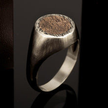 Side view highlighting the solid construction and the polished silver band of the RS-1223.