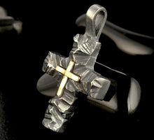 Solid silver construction of the small artisan cross, showing thick quality and rustic finish.