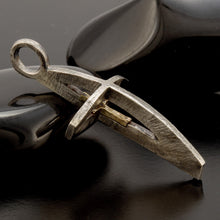 Side view of 3D hollow cross necklace showing the dimensional silver structure and gold inlay.