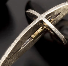Mens statement 3D cross pendant on a chain, showcasing its scale and unique artistic presence.