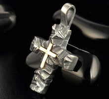 Compact silver and gold cross pendant on hand showing its refined size compared to the original P-117.