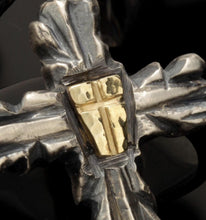 Side-by-side view of the gold and copper shield pendants, demonstrating the choice of materials for the P-156 model