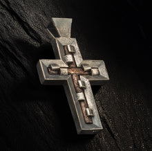 Modern handcrafted cross necklace for men and women, featuring a bold geometric silver and copper design