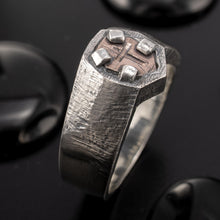 Artisan handmade RS-1427 signet ring on a dark stone background, emphasizing its ancient warrior aesthetic.
