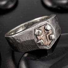 Macro detail of the hand-engraved cross on the copper shield of the RS-1427 Viking-style ring.