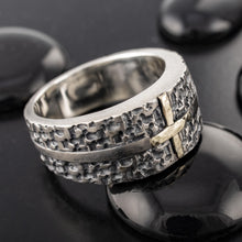 Handcrafted men's two-tone cross ring showing a solid 14K yellow gold cross in the center of a rugged textured sterling silver band.